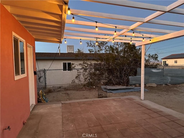 view of patio featuring a pergola and fence