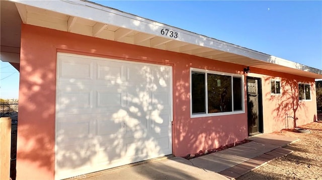 view of home's exterior featuring a garage and stucco siding