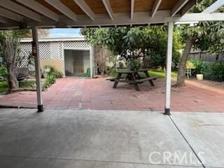 view of patio featuring fence