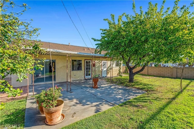 view of yard with a patio and fence