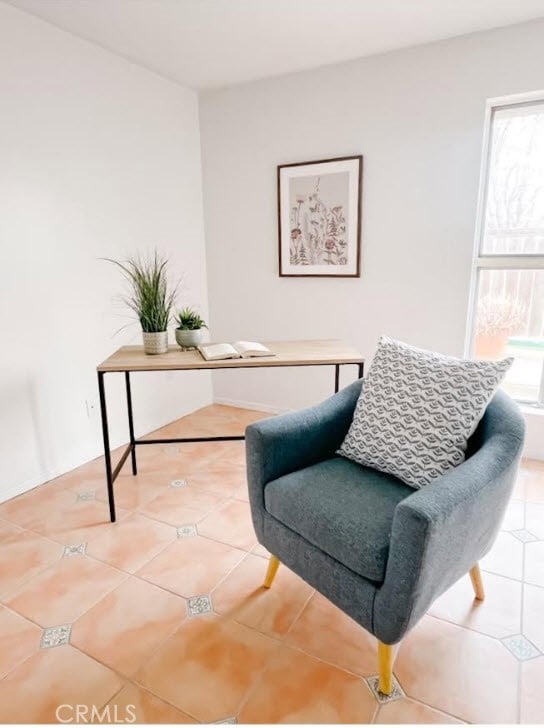 sitting room with tile patterned flooring