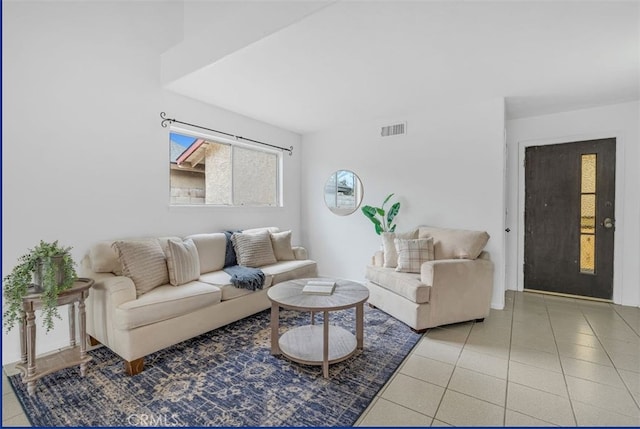 living room with light tile patterned flooring and visible vents