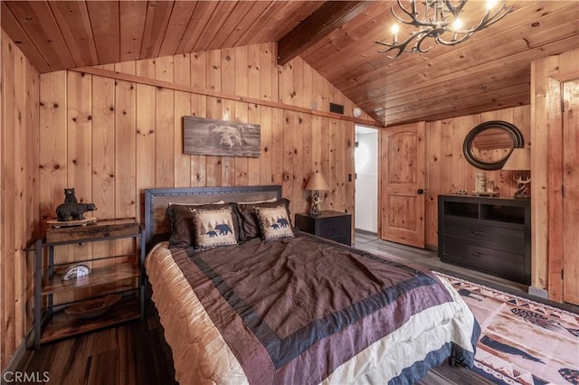 bedroom with a notable chandelier, wooden walls, wood ceiling, and vaulted ceiling