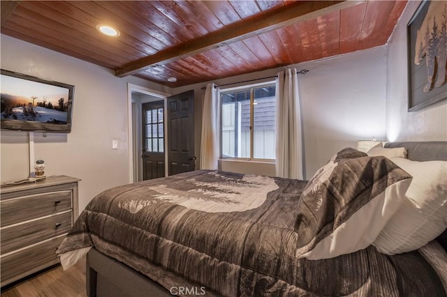 bedroom with recessed lighting, wood ceiling, and wood finished floors