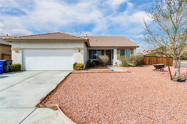 ranch-style house with fence, a tile roof, stucco siding, a garage, and driveway