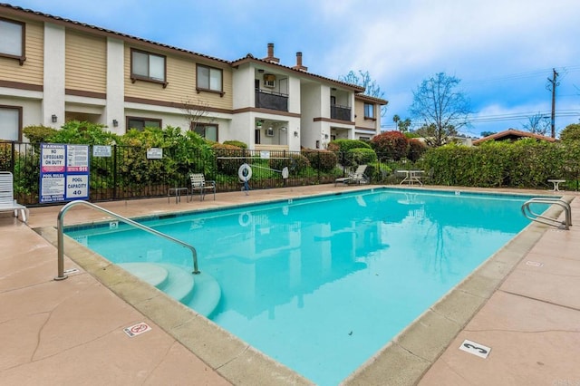 community pool with fence