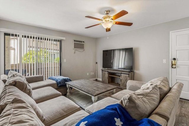 living room featuring ceiling fan, an AC wall unit, and wood finished floors