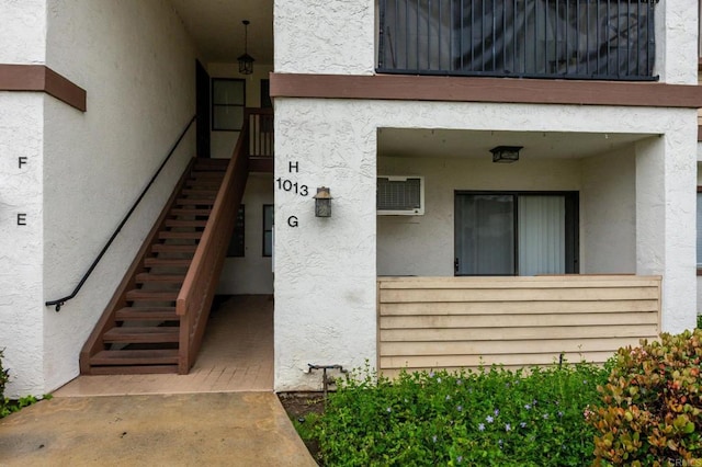 doorway to property with stucco siding