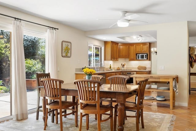 dining room featuring light tile patterned floors and ceiling fan