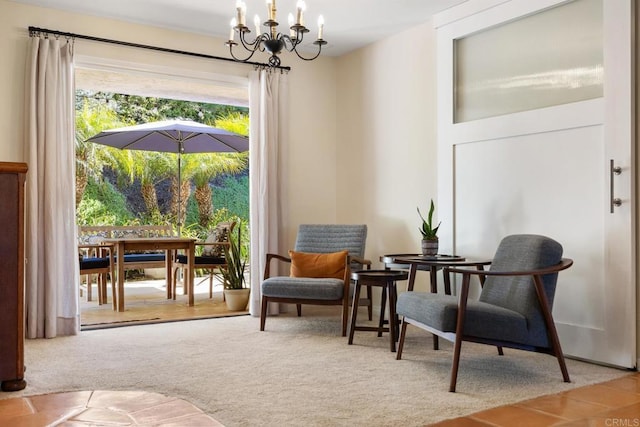 living area featuring a notable chandelier and carpet flooring