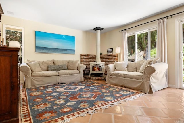 living room with a wood stove and visible vents