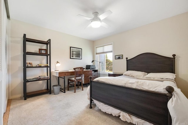 carpeted bedroom with a ceiling fan