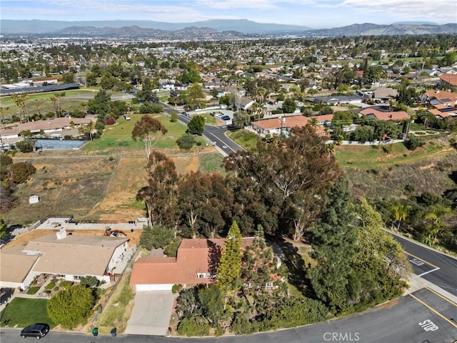 drone / aerial view featuring a mountain view and a residential view