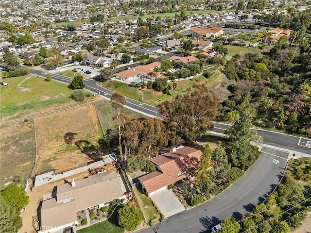 birds eye view of property with a residential view