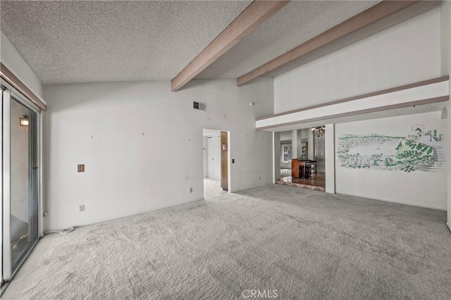 unfurnished living room featuring visible vents, a textured ceiling, lofted ceiling with beams, and carpet floors