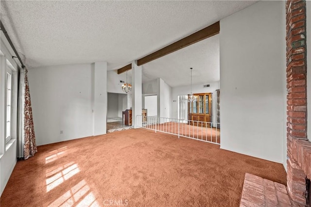 unfurnished living room featuring visible vents, vaulted ceiling with beams, carpet, a notable chandelier, and a textured ceiling