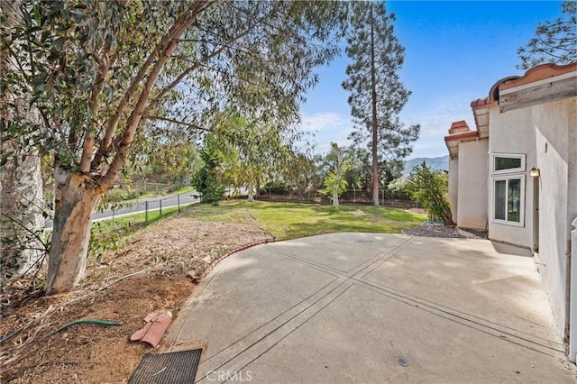 view of patio featuring fence