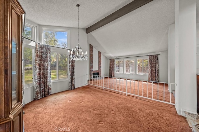 interior space with carpet, an inviting chandelier, vaulted ceiling with beams, and a textured ceiling