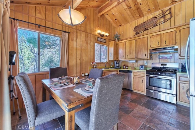 dining room with lofted ceiling with beams, wooden walls, wood ceiling, and stone finish flooring