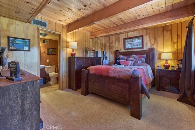 carpeted bedroom with wooden ceiling, beam ceiling, wood walls, and visible vents