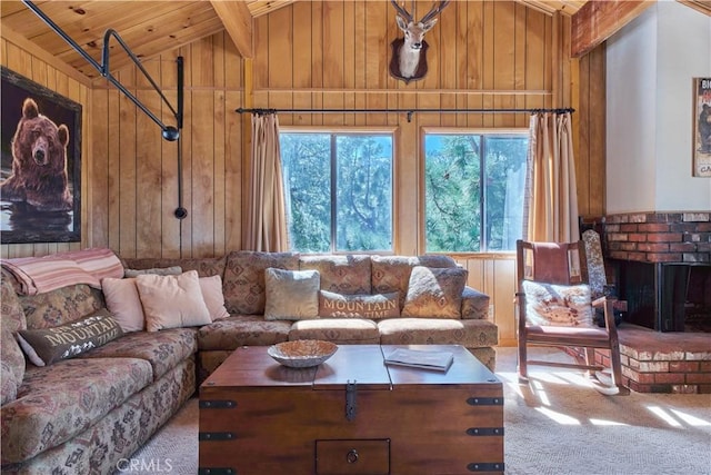 carpeted living room with a brick fireplace, wood ceiling, wood walls, and vaulted ceiling