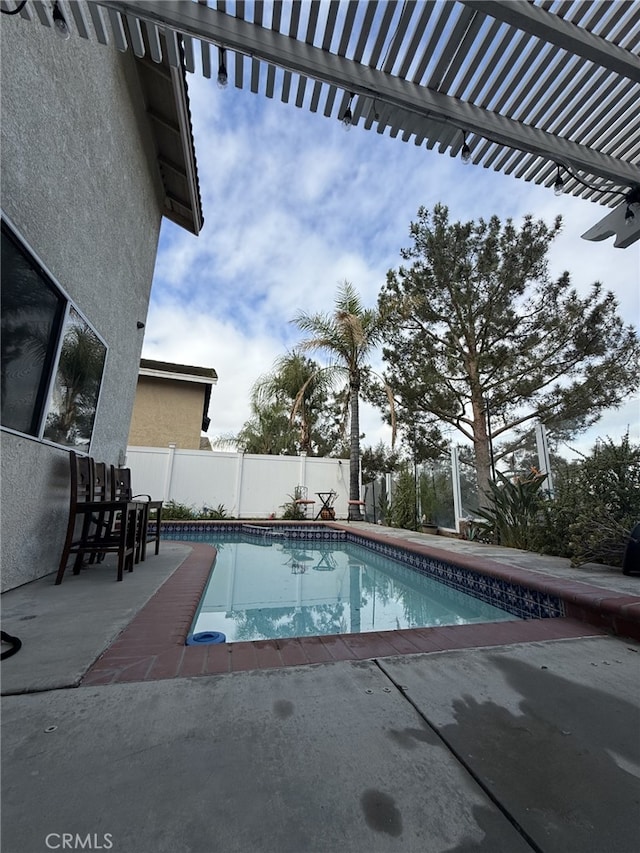 view of swimming pool with a fenced in pool, a patio, a pergola, and fence