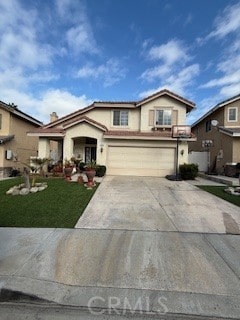 traditional-style home with stucco siding, an attached garage, concrete driveway, and a front lawn