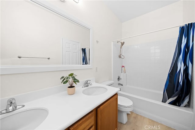 bathroom featuring a sink, toilet, double vanity, and shower / bath combination with curtain