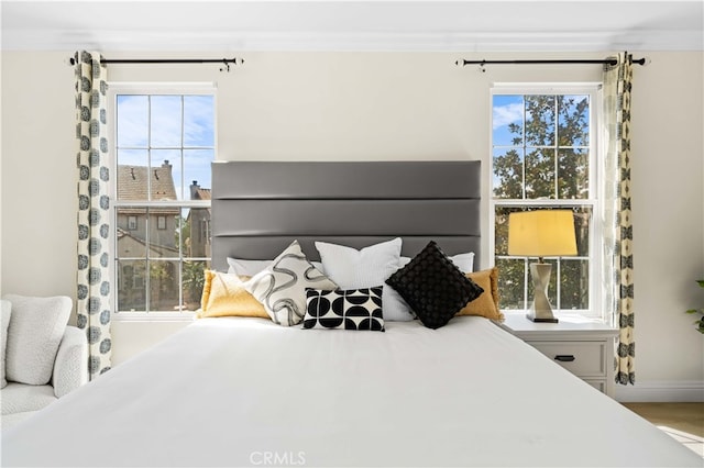 bedroom with ornamental molding