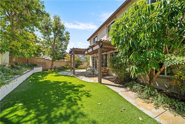 view of yard with a patio, a fenced backyard, and a pergola