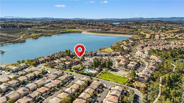 drone / aerial view featuring a residential view and a water view