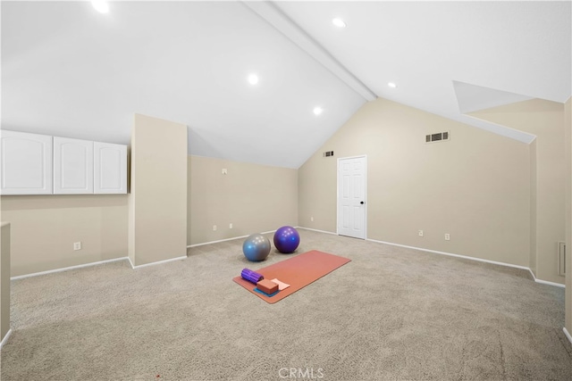 exercise area with baseboards, lofted ceiling, light carpet, and visible vents