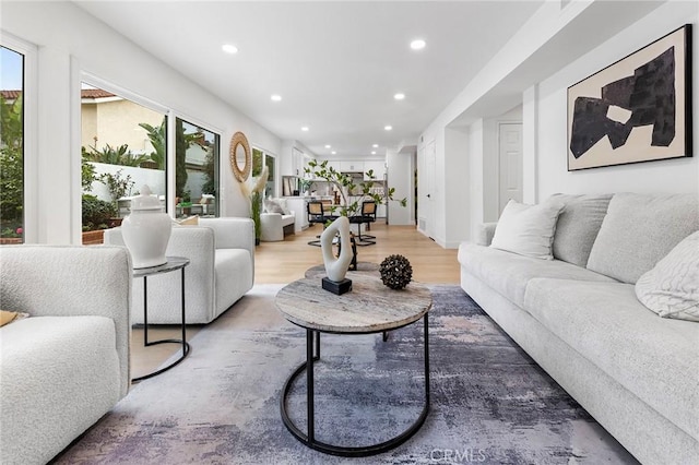 living room featuring recessed lighting and light wood-type flooring