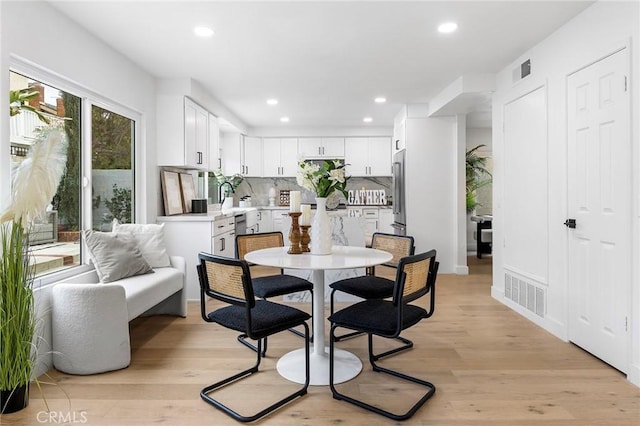 dining room featuring recessed lighting, visible vents, and light wood-style floors