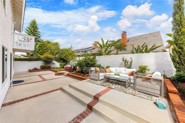 view of patio featuring a fenced backyard and an outdoor hangout area