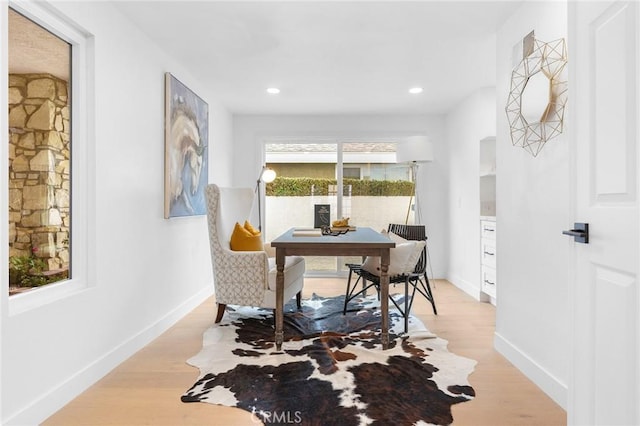 office space with light wood-style flooring, recessed lighting, and baseboards