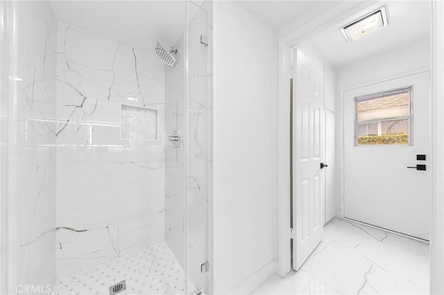 bathroom featuring marble finish floor, visible vents, and a marble finish shower