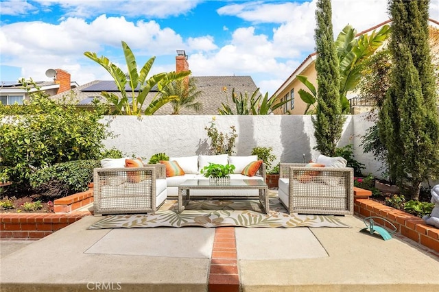 view of patio with an outdoor hangout area and a fenced backyard