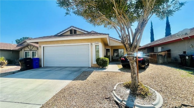 ranch-style home with stucco siding, concrete driveway, an attached garage, and fence