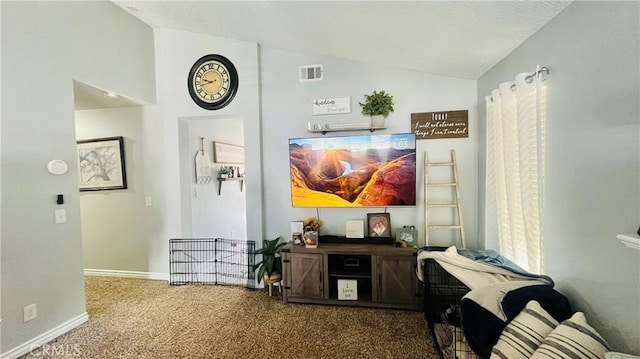 hall with visible vents, carpet floors, baseboards, and vaulted ceiling