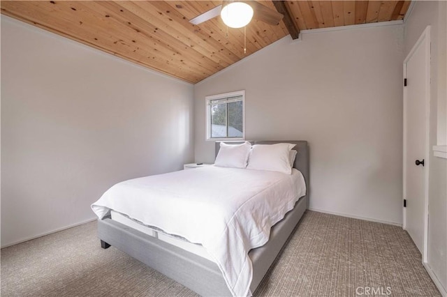 bedroom with carpet, lofted ceiling with beams, wood ceiling, and baseboards