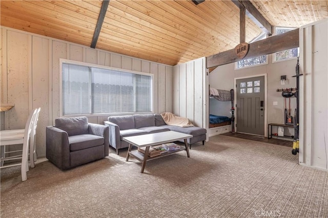 living area featuring beam ceiling, wood ceiling, and carpet floors