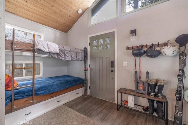 bedroom featuring wood finished floors, wooden ceiling, and vaulted ceiling