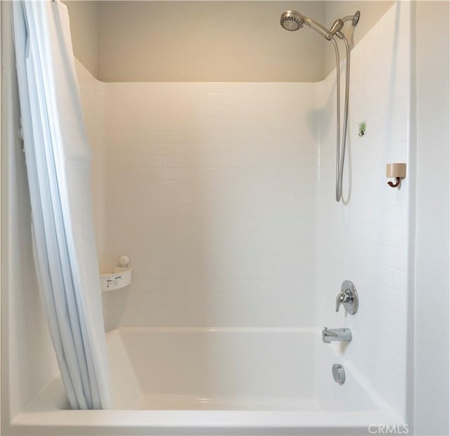 full bath featuring shower / bath combo with shower curtain