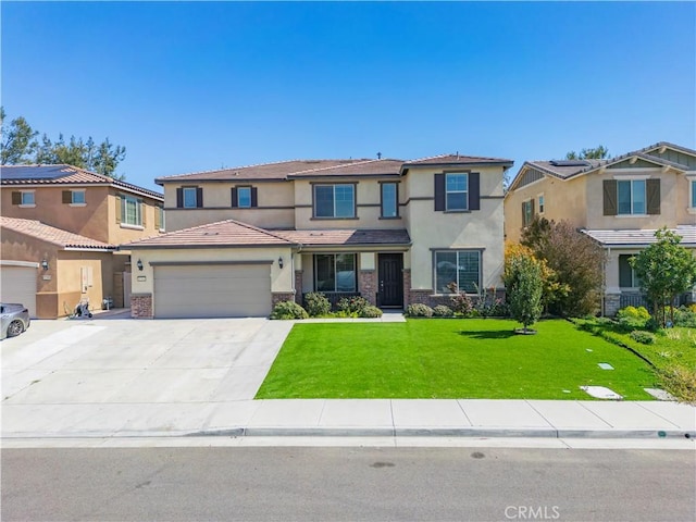 view of front of property with an attached garage, a tiled roof, a front yard, stucco siding, and driveway