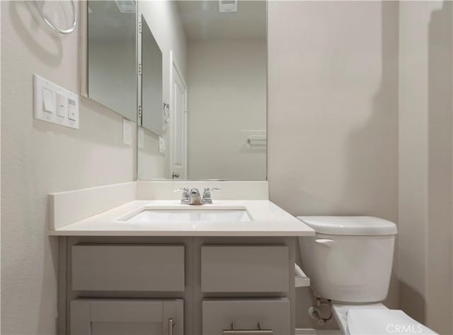 half bath with toilet and vanity