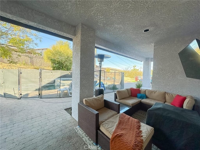 view of patio / terrace featuring an outdoor living space, a gate, and fence