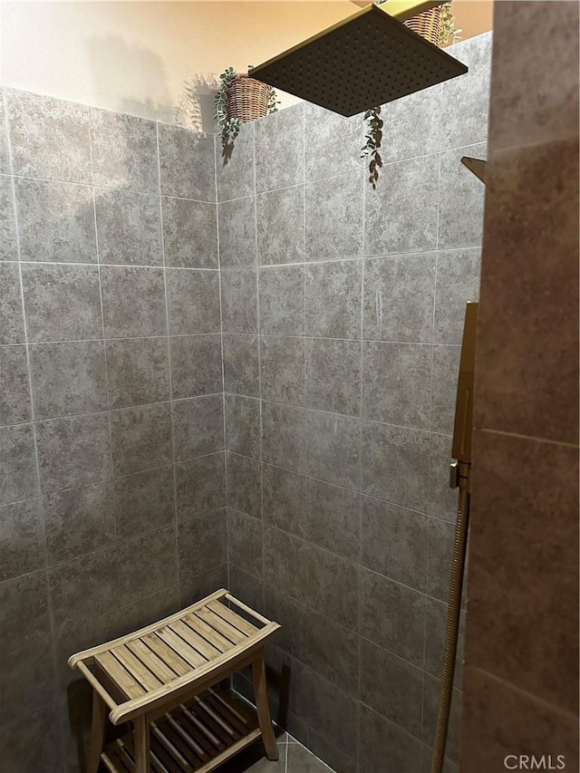 full bathroom with tiled shower