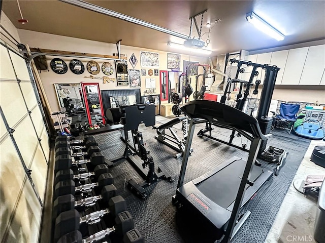 exercise room with a garage