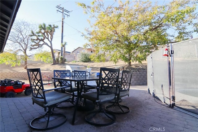 view of patio / terrace featuring outdoor dining area and a fenced backyard